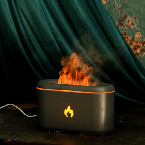 Diffuseur d'arômes effet flamme noir allumé dans une ambiance sombre